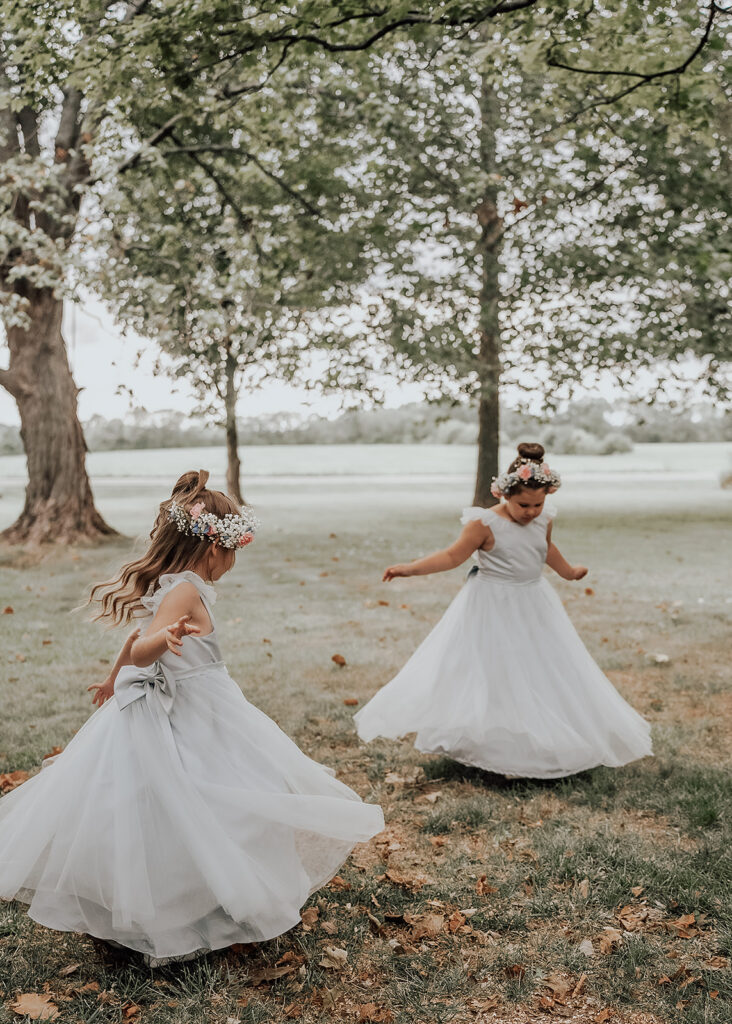 Cedar Bay Farm Flowergirls Twirling In Front Of Property