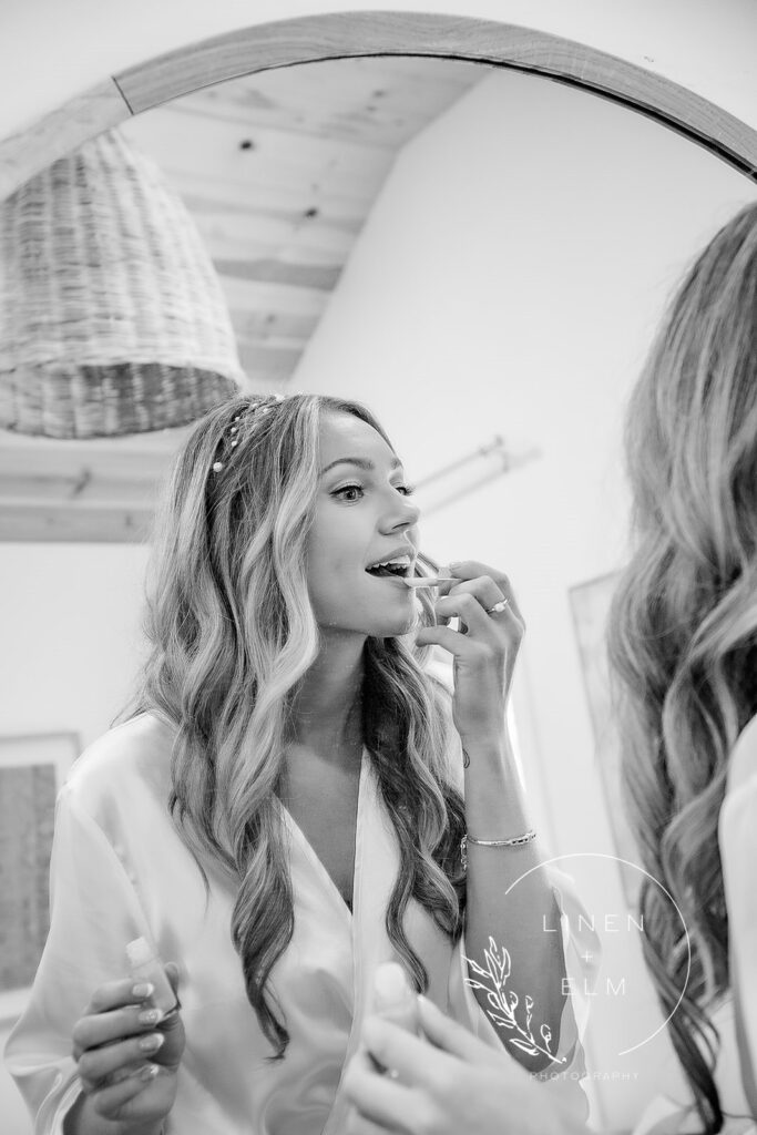 Bride Getting Ready Before Wedding Applying Lipstick In Mirror