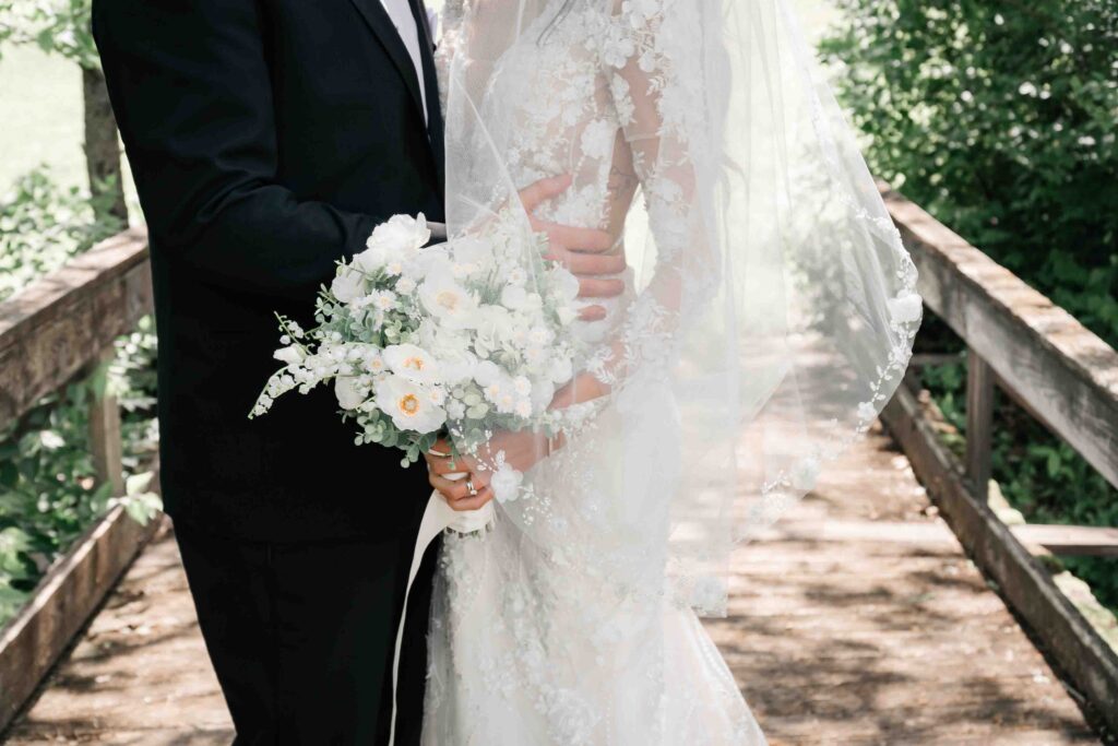 Cedar Bay Farm Bridal Couple On Bridge Close Up Of Florals